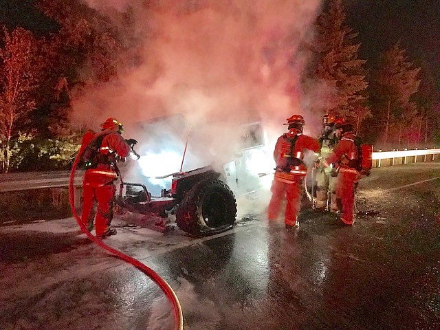 Photo by SHOSHONE COUNTY FIRE DISTRICT NO.1/Steam rises from the Jeep as fire personnel spray the vehicle with water.