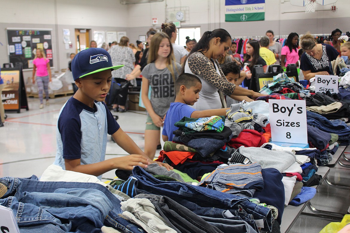 Cheryl Schweizer/Columbia Basin HeraldKids and parents found clothes to go stylin' back to school at the Back 2 School distribution Friday at Larson Heights Elementary.