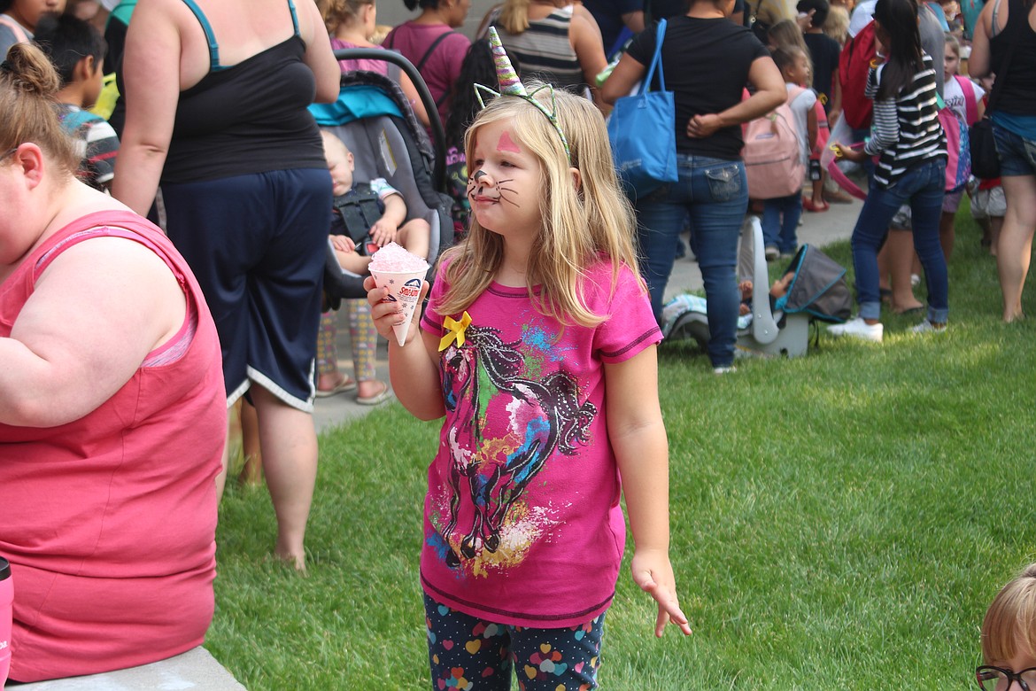 Cheryl Schweizer/Columbia Basin HeraldSno-cones and face painting were part of the fun at the Back 2 School distribution Friday at Larson Heights Elementary.