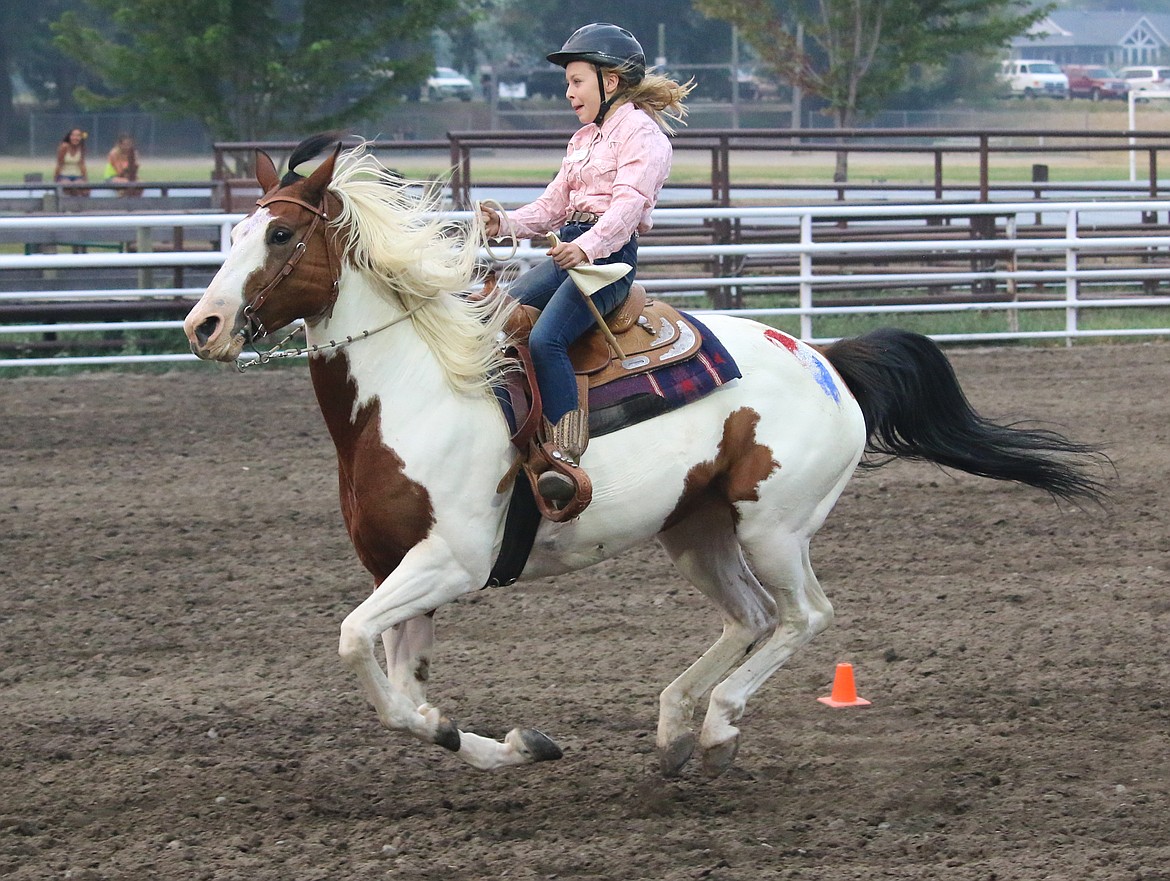 Photo by MANDI BATEMAN
Racing for home, flag in hand.