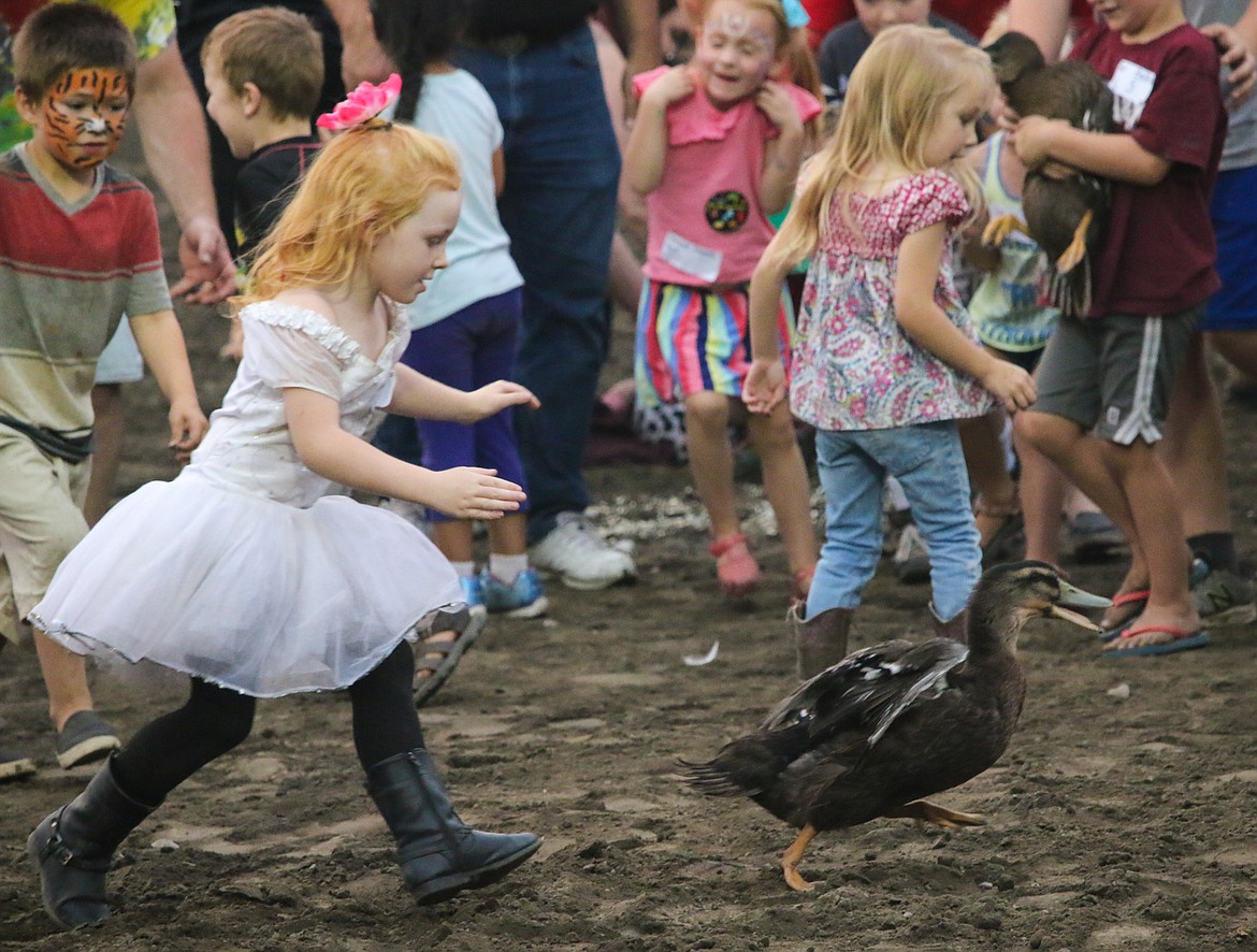 Photo by MANDI BATEMAN
A young girl has her eyes set on a duck she wants.