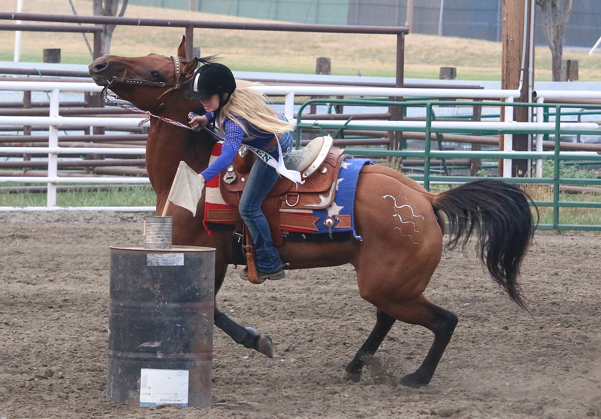 Photo by MANDI BATEMAN
Not all the horses liked the idea of slowing down for their riders to retrieve the flag.