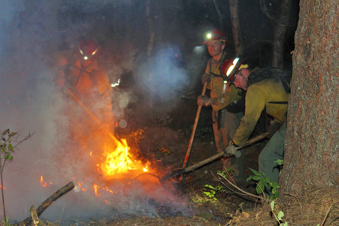 A team of IDL firefighters work to extinguish part of the blaze.