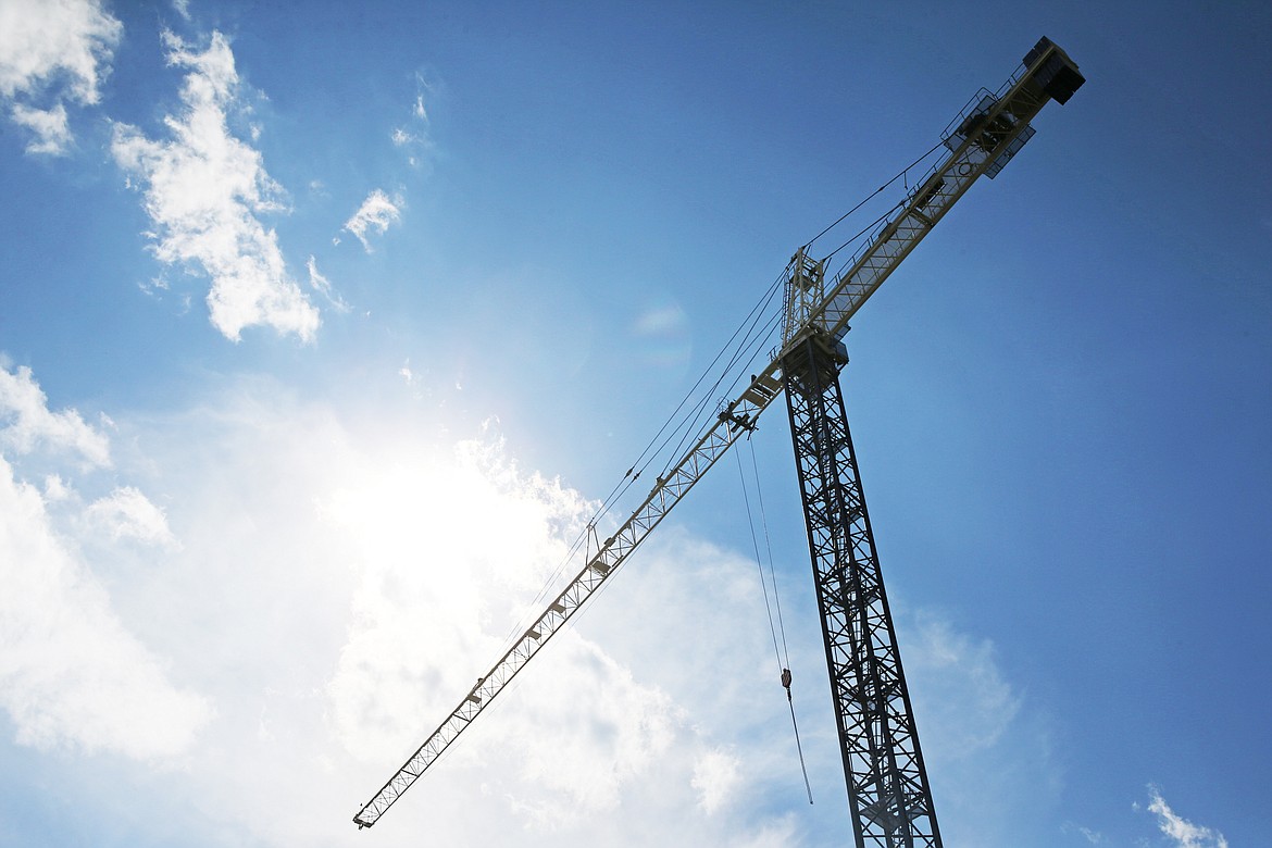 LOREN BENOIT/Press
A construction crane towers over the Coeur d&#146;Alene skyline as construction continues on the One Lakeside high-rise project on Thursday.