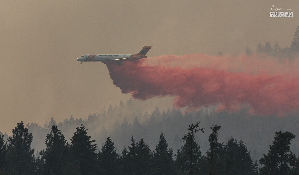 Photo by ELAINE WHEATLEY
Elaine Wheatley took this photos on the west end of Fawn Lane of a tanker jet dropping its fire retardant cargo on the Fleming Creek fire.