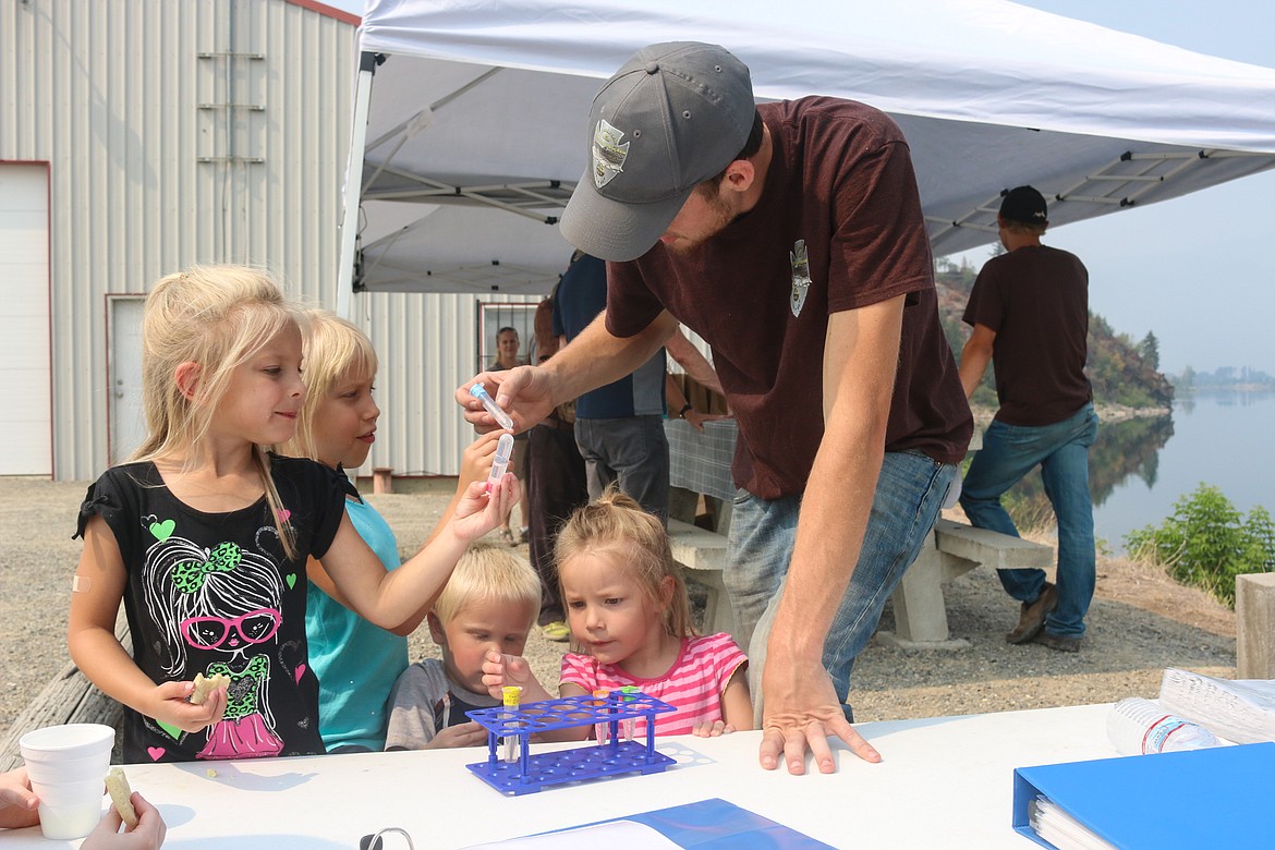 Photo by MANDI BATEMAN
Brycen Lunger educates children about the early lifescycles of Burbot.