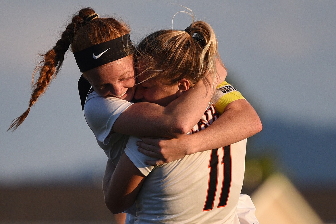 Flathead's Skyleigh Thompson, left, and Chloe Nadeau celebrate after Thompson's goal against Glacier during a crosstown matchup at Legends Stadium on Thursday. (Casey Kreider/Daily Inter Lake)