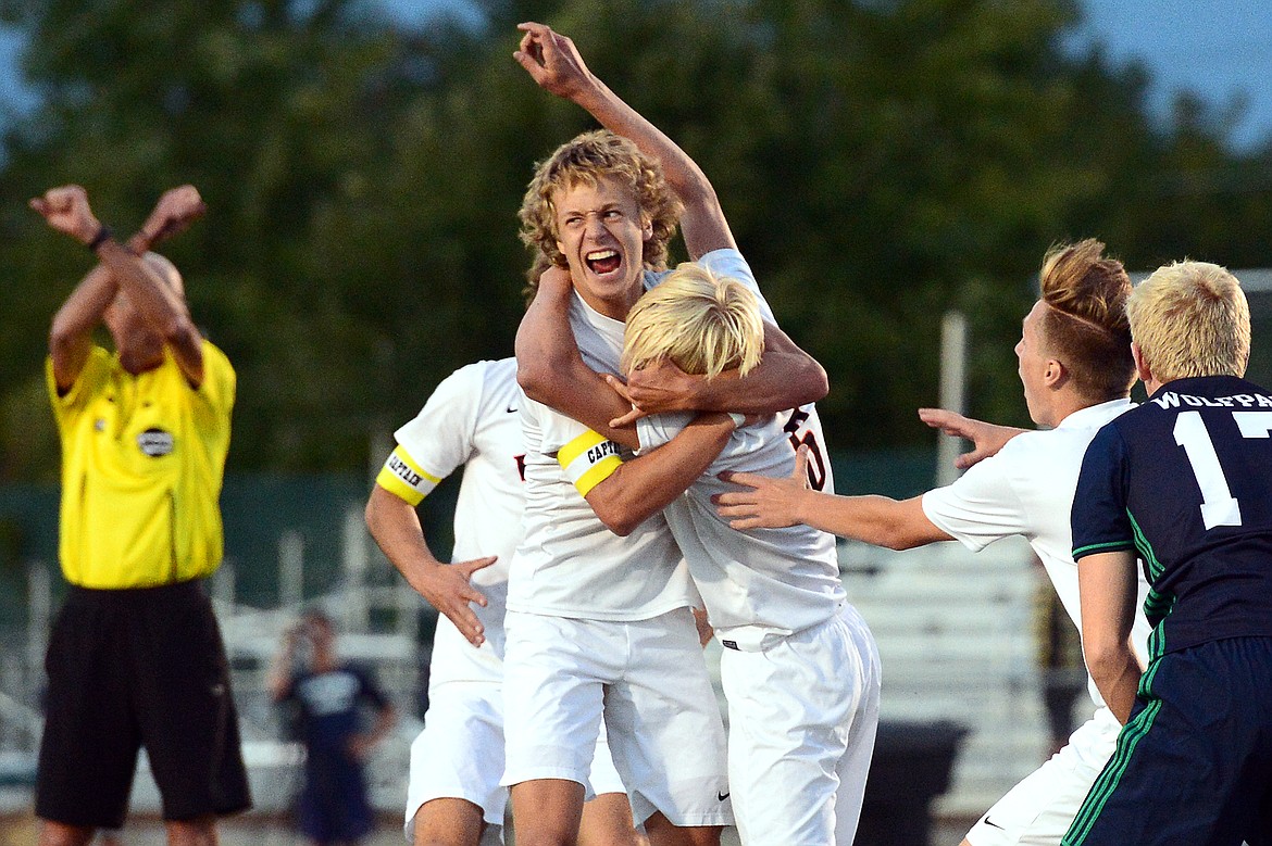 Flathead's Jalen Hawes (7) celebrates with teammate Eric Gardner (6) after Gardner's goal in the first half during a crosstown matchup with Glacier at Legends Stadium on Thursday. (Casey Kreider/Daily Inter Lake)