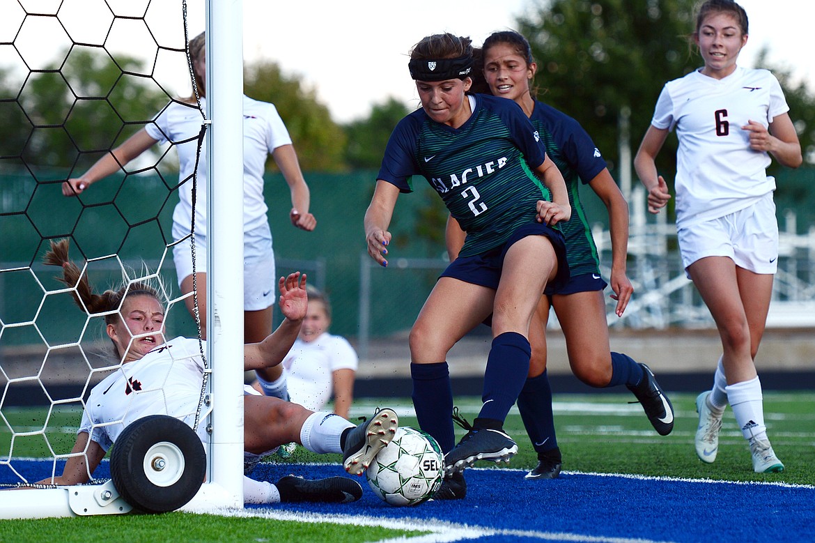 Flathead's Kami Darrow (4) blocks a shot on goal by Glacier's Emily Cleveland after a Wolfpack corner kick during a crosstown matchup at Legends Stadium on Thursday. (Casey Kreider/Daily Inter Lake)