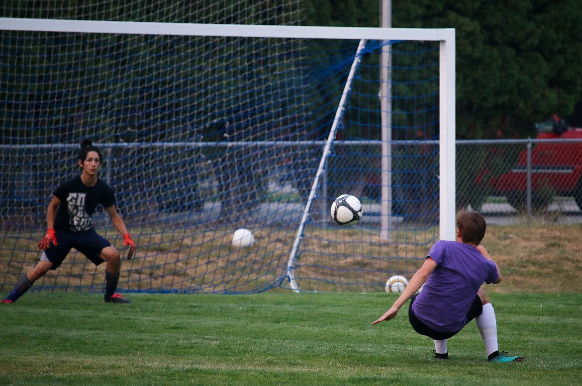 Photo by MANDI BATEMAN
Jaden Clair attempts a shot on freshman keeper Keahi Robles.