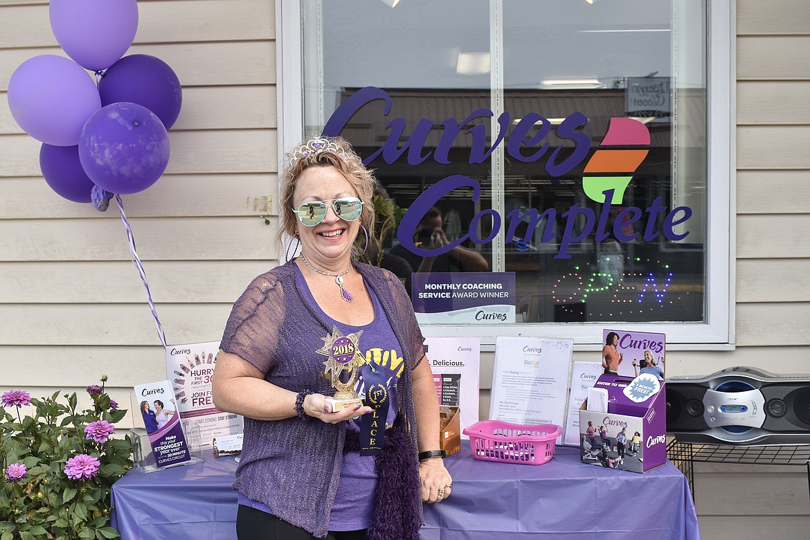 Jonette Tubb, owner of Curves in Libby, holds the &#147;All-Out Crazy&#148; award she won for her costumes and presentation Saturday. (Photos by Ben Kibbey/The Western News)