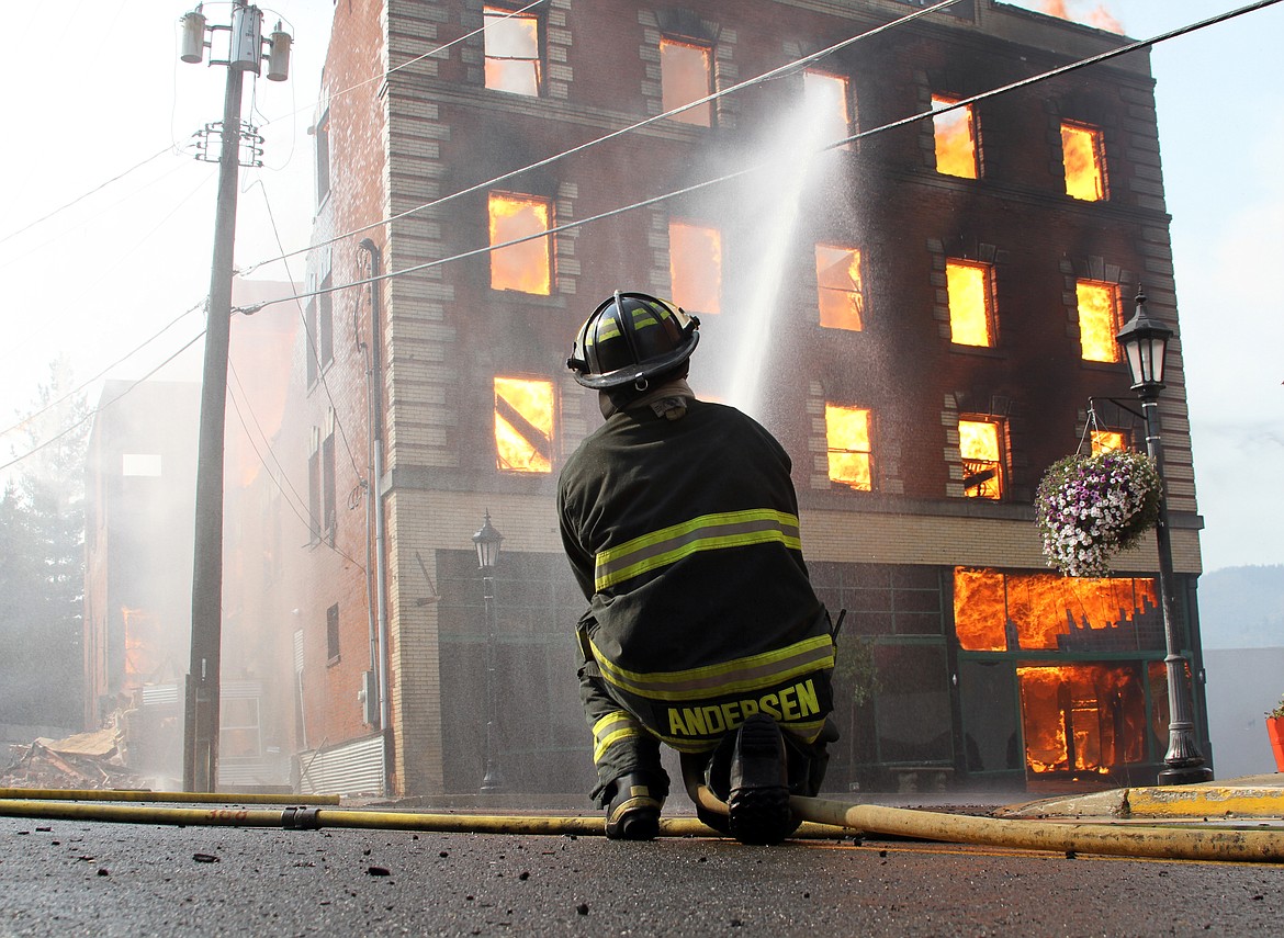 Photo by JOSH MCDONALD
Shoshone Fire District No. 2 firefighter Joe Andersen as he fought the McConnell Hotel fire one year ago.