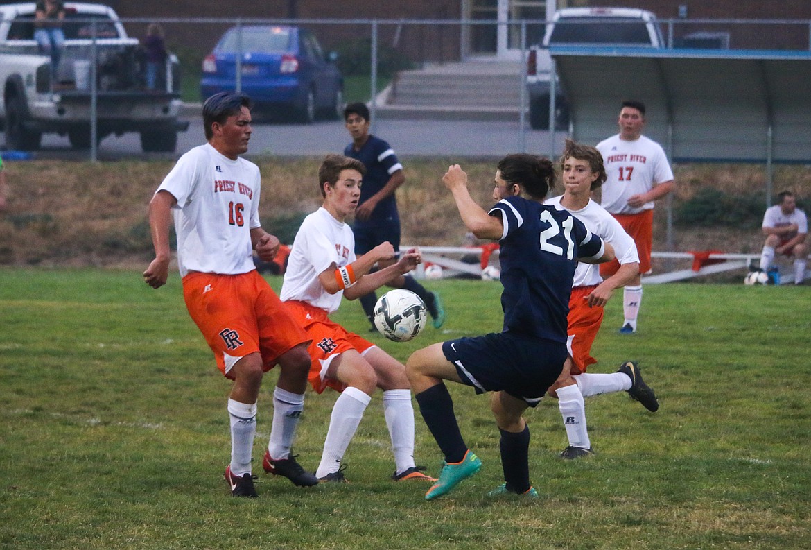 Photo by MANDI BATEMAN
Preston McLeish setting up to take a shot on goal, defended by Priest River.