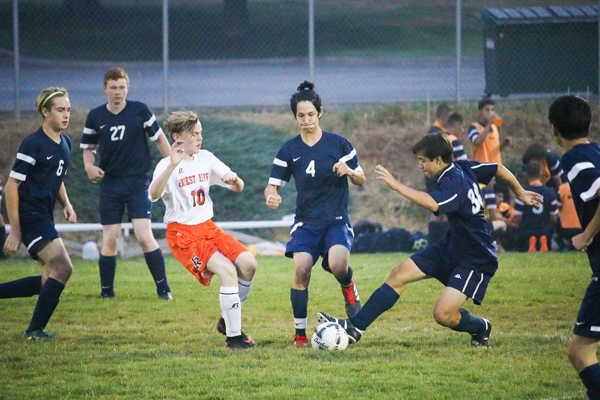 Photo by MANDI BATEMAN
Noah Walker and Keahi Robles converge on the ball in front of their goal.