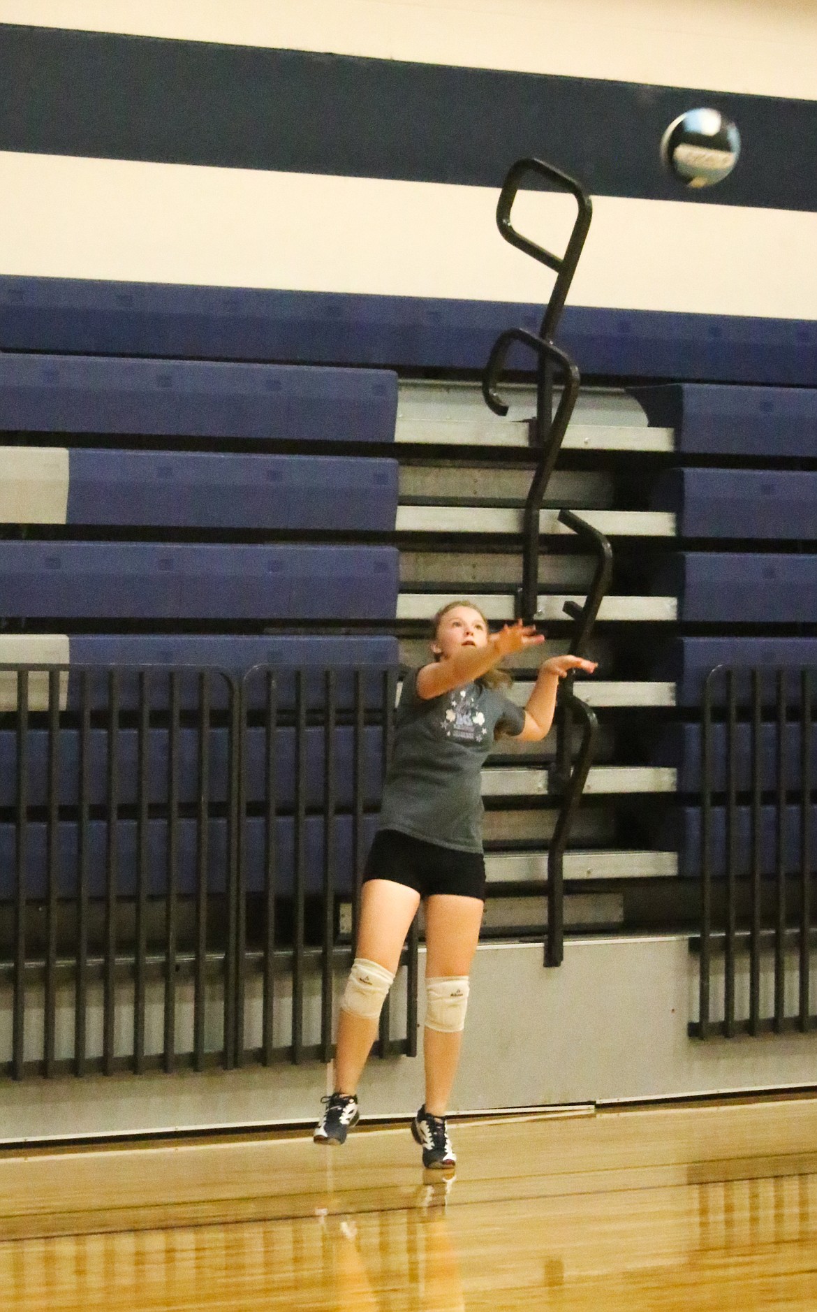 Photo by MANDI BATEMAN
Malory McLiesh practicing serving during their normal drills.