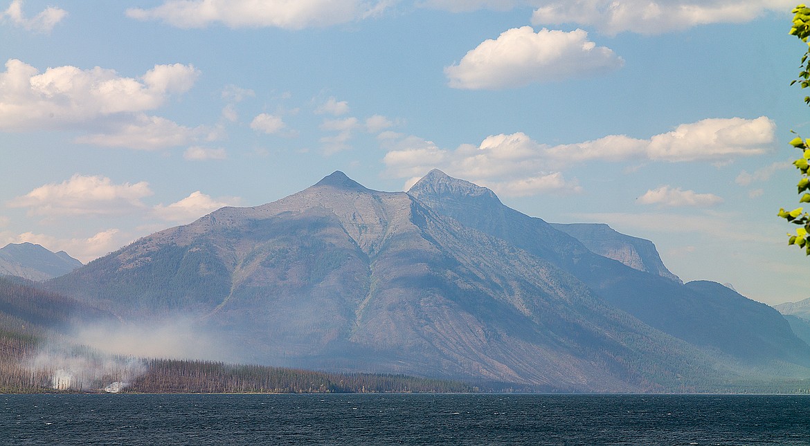 The Howe Ridge Fire was burning in dead and downed timber along Lake McDonald Thursday, leftover debris from the Robert Fire 15 years ago.