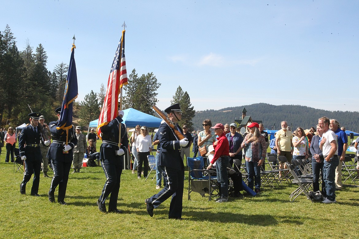 Members of the Fairchild Air Force Base Honor Guard present the flag during the opening ceremony of the Coeur d'Alene Chamber of Commerce's debut COEURfest in McEuen Park on Saturday morning. The ceremony also included a Fairchild jet flyover and opening remarks by Lt. Gov. Brad Little. (DEVIN WEEKS/Press)