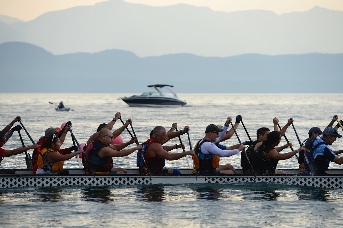 Paddlers row back to shore after a race at the Dragon Boat Festival at Volunteer Park in Lakeside on Saturday. (Casey Kreider/Daily Inter Lake)