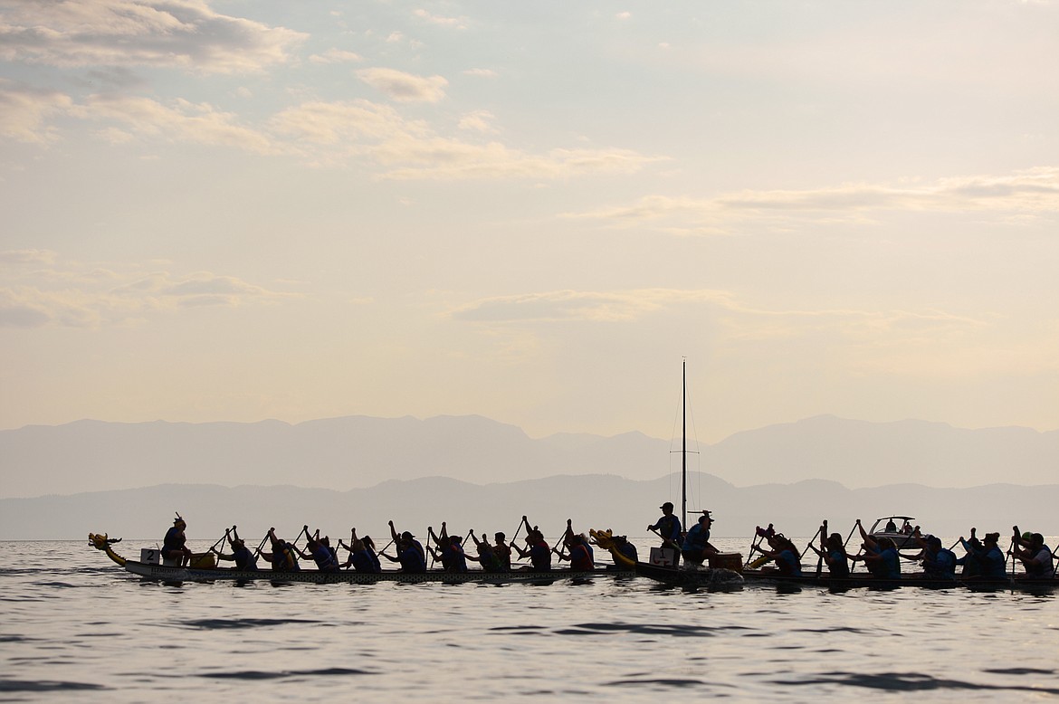 EDBRC Got Gainz Mixed, left, from Edmonton, and WD-20, from Kalispell, race during the Dragon Boat Festival at Volunteer Park in Lakeside on Saturday. (Casey Kreider/Daily Inter Lake)