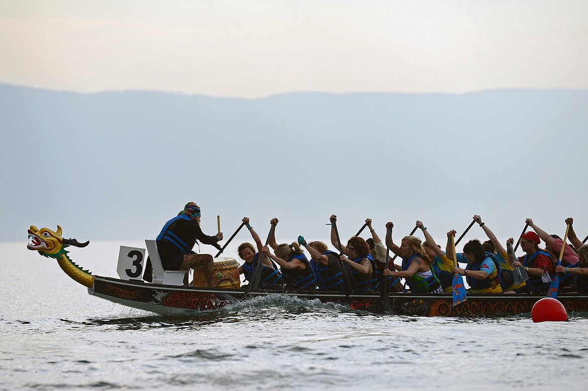 Leavitt Great West, from Kalispell, row during their race at the Dragon Boat Festival at Volunteer Park in Lakeside on Saturday. (Casey Kreider/Daily Inter Lake)