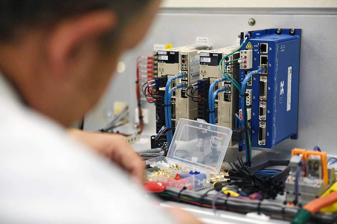 Shaun Emerson performs subassembly work at his station in the applications lab at ClassOne Technology in Evergreen on Thursday, Aug. 23. (Casey Kreider/Daily Inter Lake)