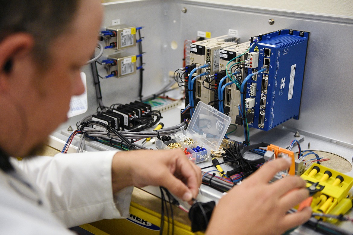 Shaun Emerson performs subassembly work at his station in the applications lab at Class One Technology in Evergreen.