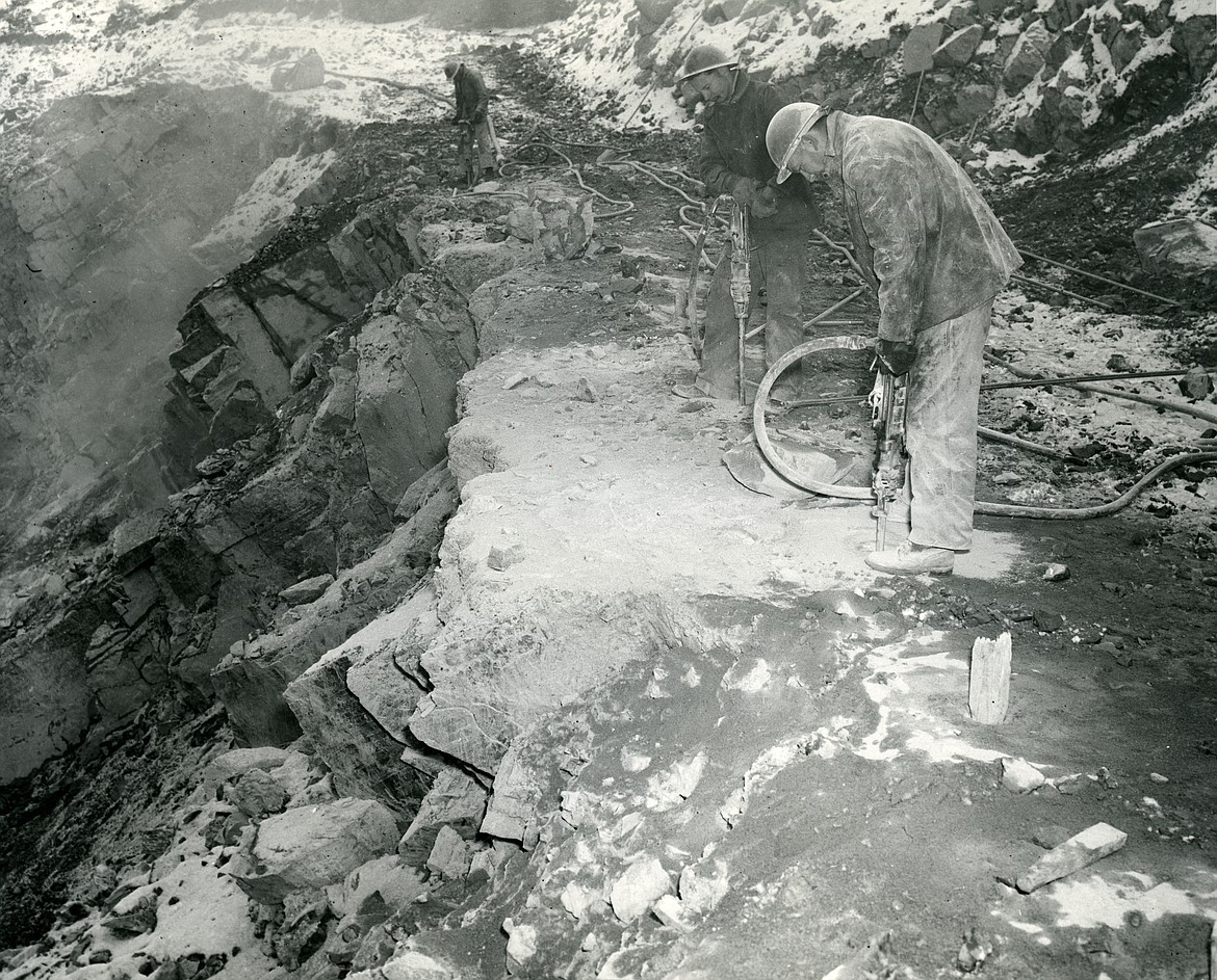 A man works a jackhammer at the site of the Hungry Horse Dam. (Photo courtesy of EB Gilliland Collection)