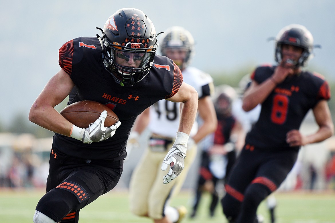 Flathead's Logan Siblerud (1) heads to the end zone on a 20-yard touchdown reception in the second quarter against Billings West at Legends Stadium on Friday. (Casey Kreider/Daily Inter Lake)