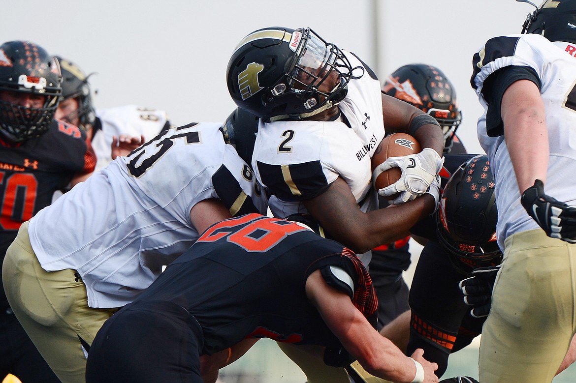 Billings West running back Demarcus Carr is bottled up by the Flathead defense at Legends Stadium on Friday. (Casey Kreider/Daily Inter Lake)