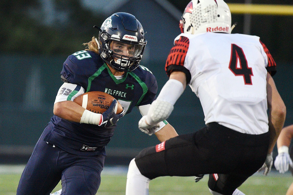 Glacier running back Preston Blain looks to get past Bozeman defensive back Ryan Simpson on a second-quarter run at Legends Stadium on Friday. (Casey Kreider/Daily Inter Lake)