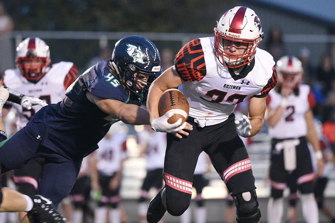 Glacier's Ethan Baines (45) brings down Bozeman running back Joe Olson (33) on a second quarter carry at Legends Stadium on Friday. (Casey Kreider/Daily Inter Lake)