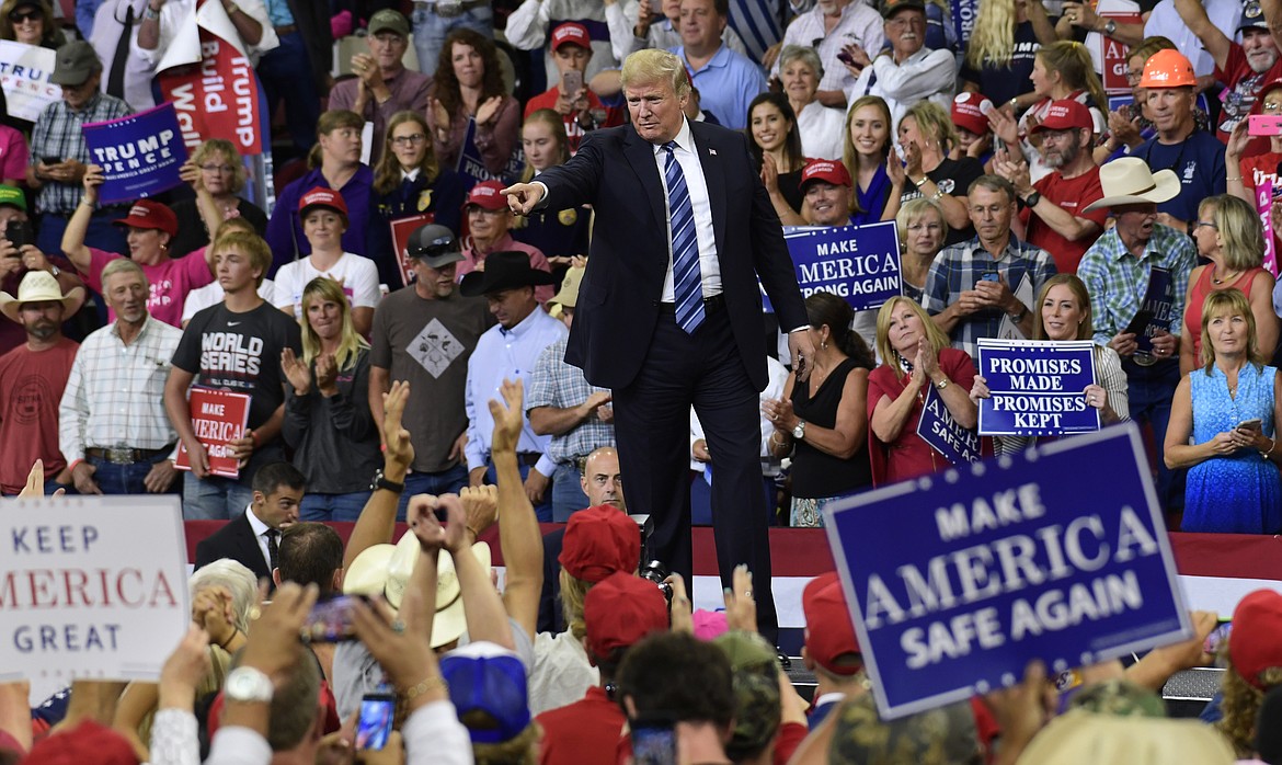 President Donald Trump points to people in the crowd as he finishes his speech at a rally in Billings, Mont., Thursday, Sept. 6, 2018.(AP Photo/Susan Walsh)