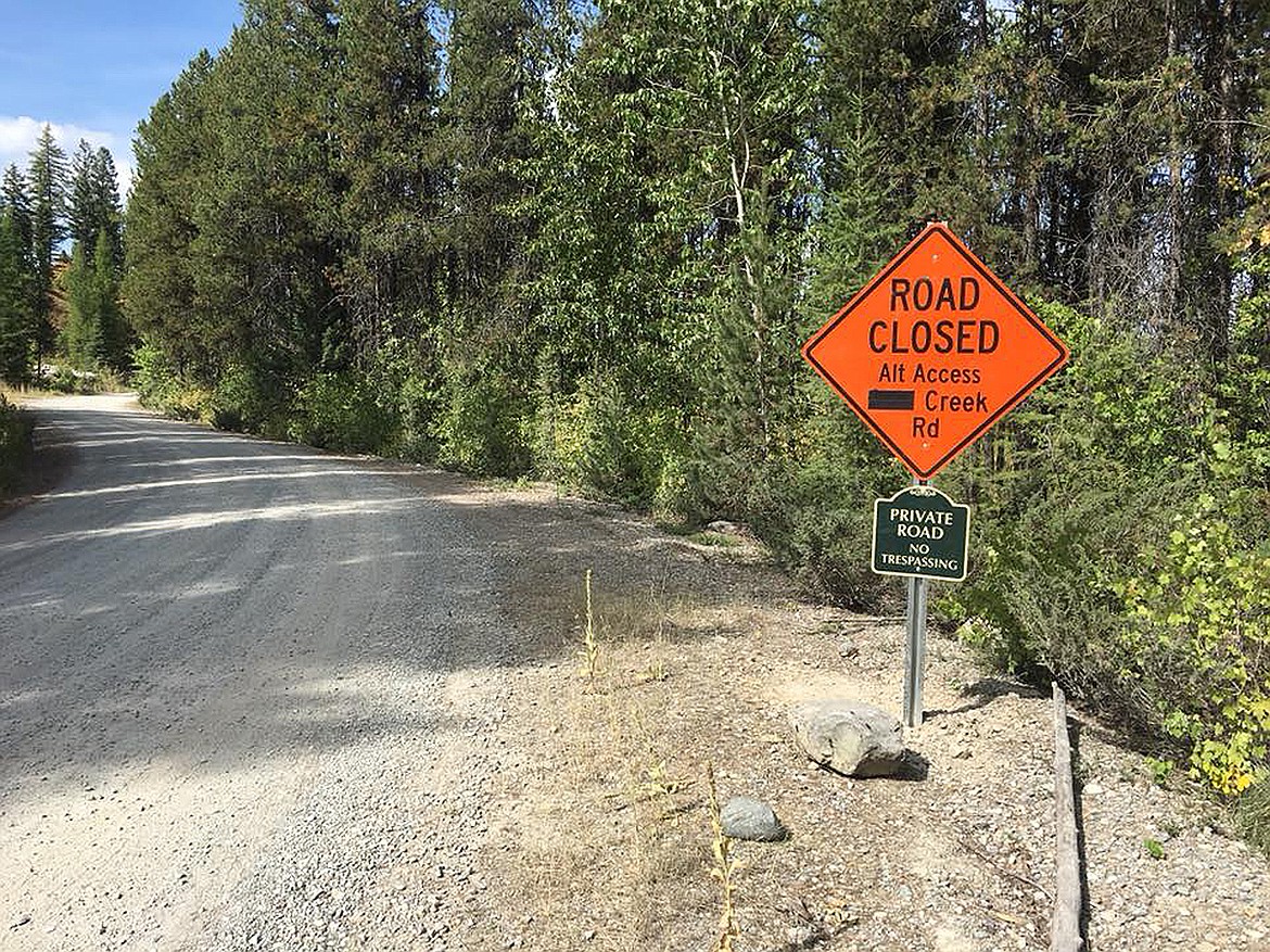 A sign on North Evers Creek Road alerts drivers of it being closed ahead. There is a looming dispute over whether the road can be closed.