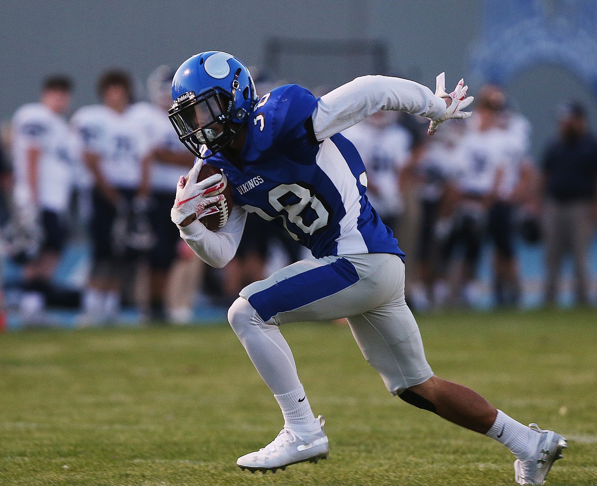 Coeur d&#146;Alene wide receiver Isaac Kay catches the ball and heads upfield against Gonzaga Prep.