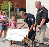 9-year-old girl raises more than $20,000 for K9
