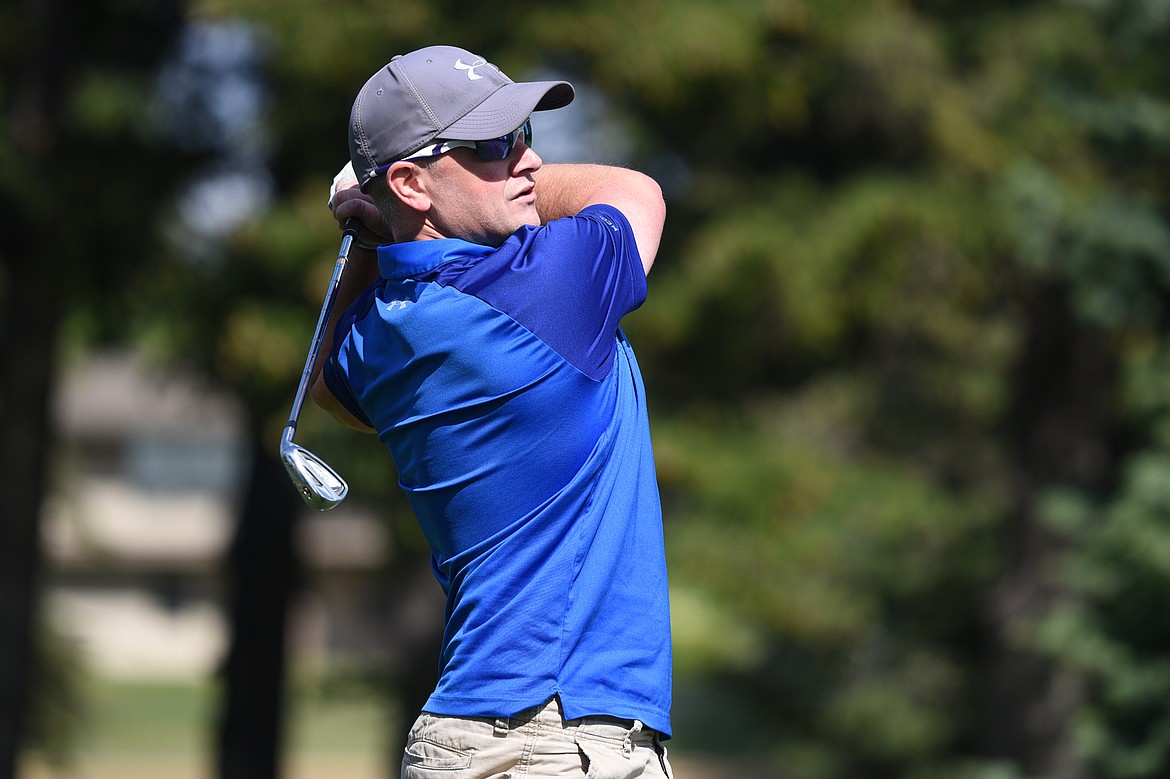 Ryan Santa, of Kalispell, watches his tee shot on hole seven of the Cameron 9 course during the Labor Day Tournament at Buffalo Hill Golf Club in Kalispell on Saturday. (Casey Kreider/Daily Inter Lake)