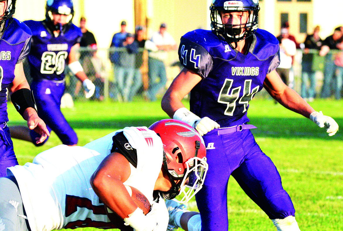 CHARLO HIGH School defensive lineman Bridger Foust (44) converges on Arlee RB Darshon Bolen during the first half of the Charlo-Arlee game Friday afternoon at Charlo High School. (Jason Blasco/Lake County Leader)