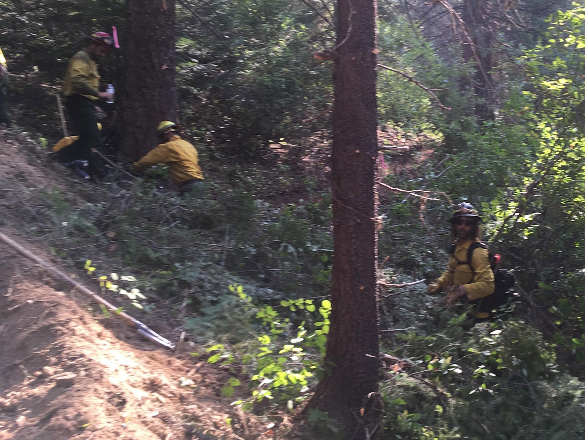 NorEast Crew members work on a structure protection handline to the west of the Gold Hill fire perimeter on Aug. 29. (Photo by Ben Brack)