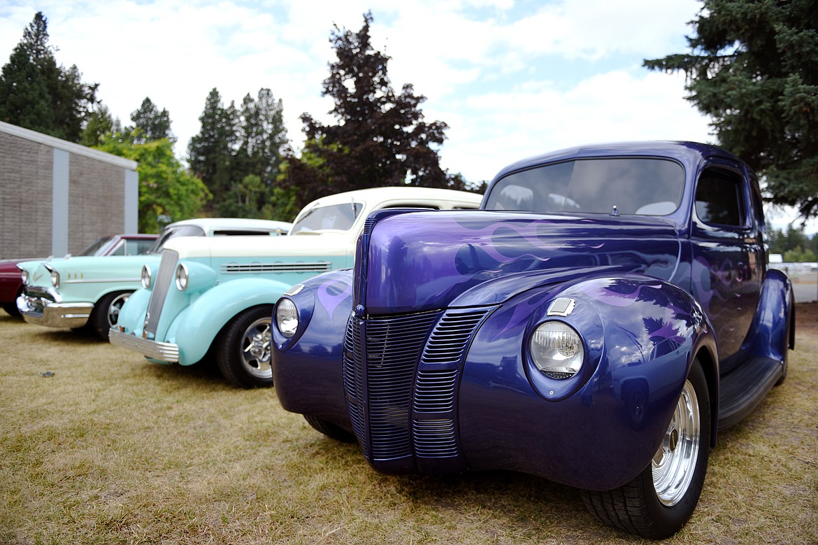 Classic cars, including Dennis Andersen&#146;s purple 1940 Ford, line up outside VFW Post 4042 in Bigfork before the poker run around Flathead Lake.
 for the 11th annual Rumble in the Bay car, truck and motorcycle show on Saturday morning. (Casey Kreider/Daily Inter Lake)