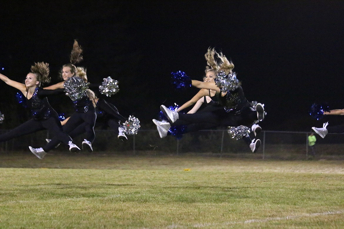 Photo by MANDI BATEMAN
Catching air during the pom routine.