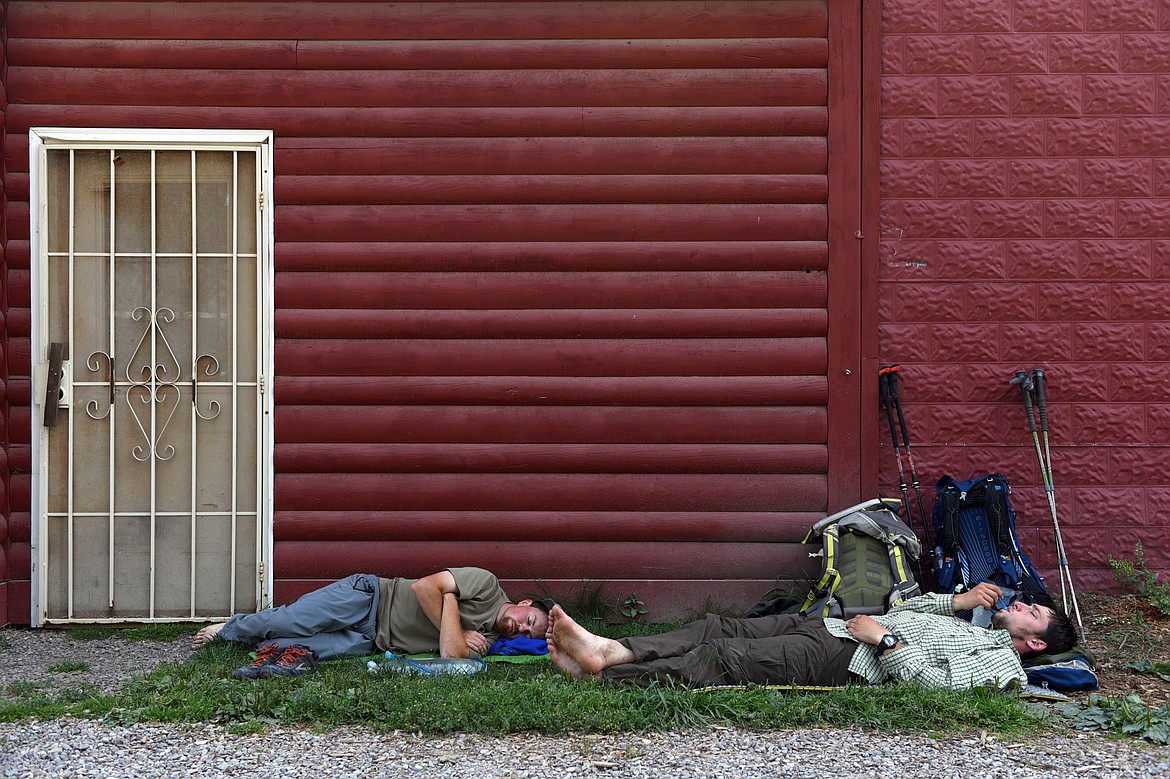 Hikers rest outside Polebridge Mercantile on Friday, Aug. 10. (Casey Kreider/Daily Inter Lake)