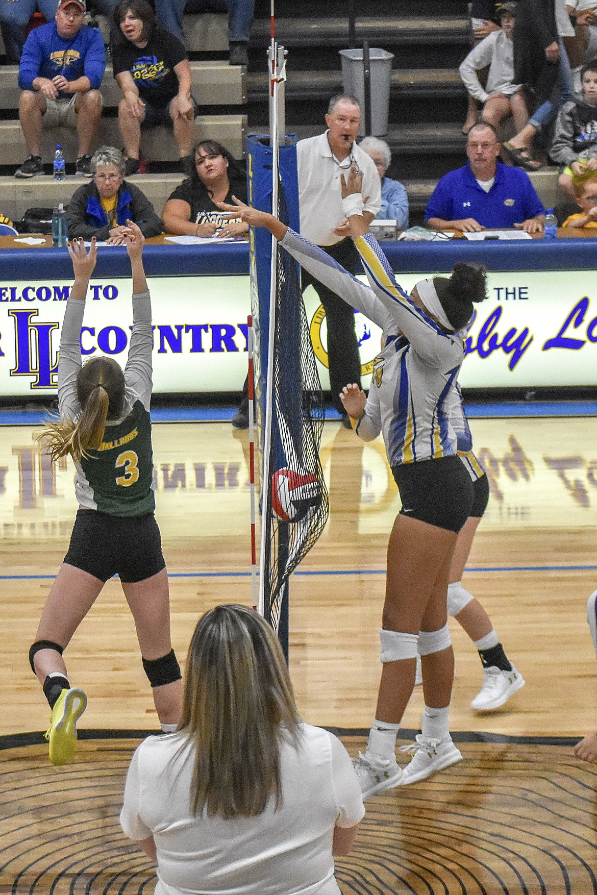 A successful block by Libby senior Mehki Sykes during the Lady Loggers&#146; 3-1 win over Whitefish Saturday. (Ben Kibbey/The Western News)