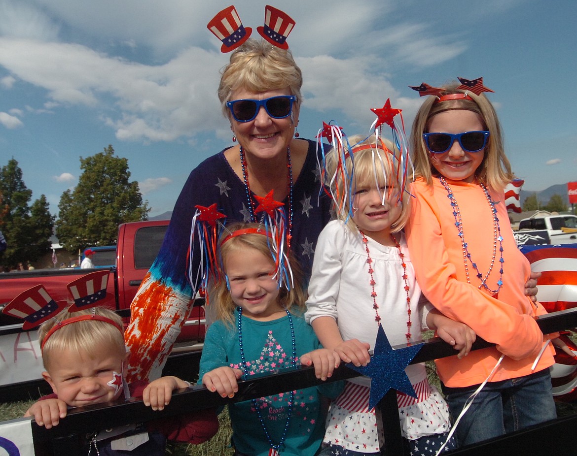 Lisa French joined her grandkids, from left, Lane, Paisley, Mady and Karissa on the Farmers Union float during the Sanders County Fair Parade. (Joe Sova/Clark Fork Valley Press)
