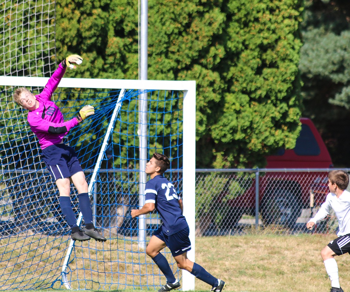 Photo by MANDI BATEMAN
Badger goalie jumps to protect the net.