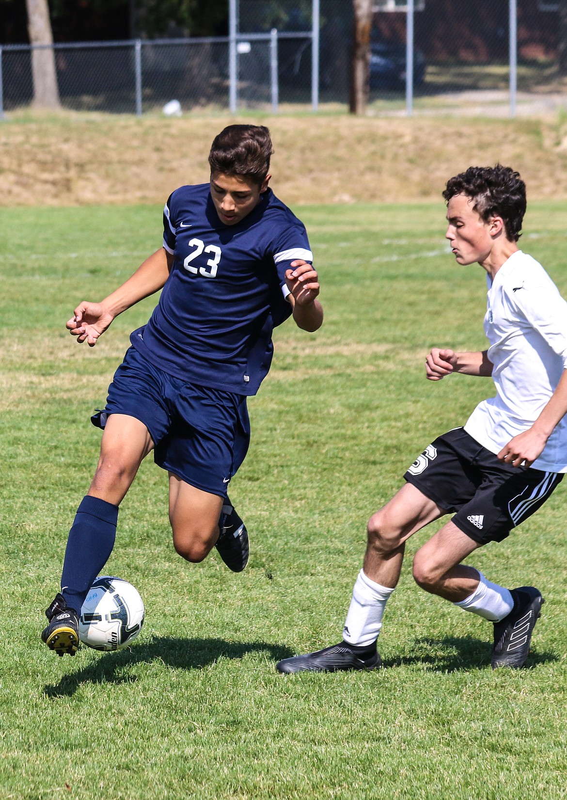 Photo by MANDI BATEMAN
Daniel Walker dribbles past a St. Maries defender during the Badgers&#146; 3-0 win on Aug. 31.