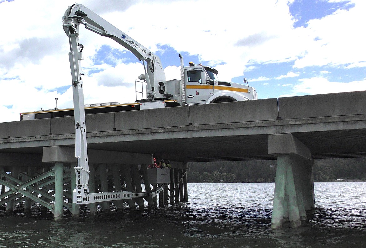 (Photo courtesy IDAHO TRANSPORTATION DEPARTMENT)
&#147;Kenny,&#148; the Idaho Transportation Department&#146;s Kenworth under-bridge inspection truck, has been utilized on bridges across Idaho this summer, including here on the Long Bridge near Sandpoint. It has also been used for bridge inspections throughout Kootenai County.