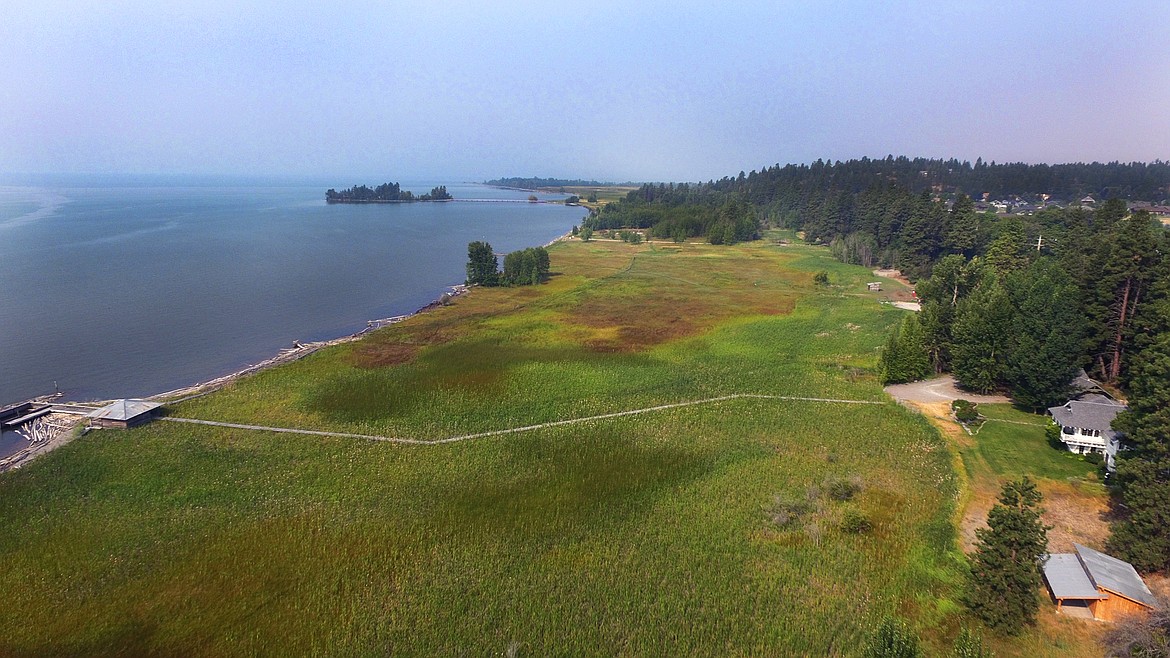 A 21-acre property on Flathead Lake in Bigfork that includes a 4,751-square-foot home will go up for acution next week. A boardwalk from the main house leads to a lakehouse. (Photos provided)