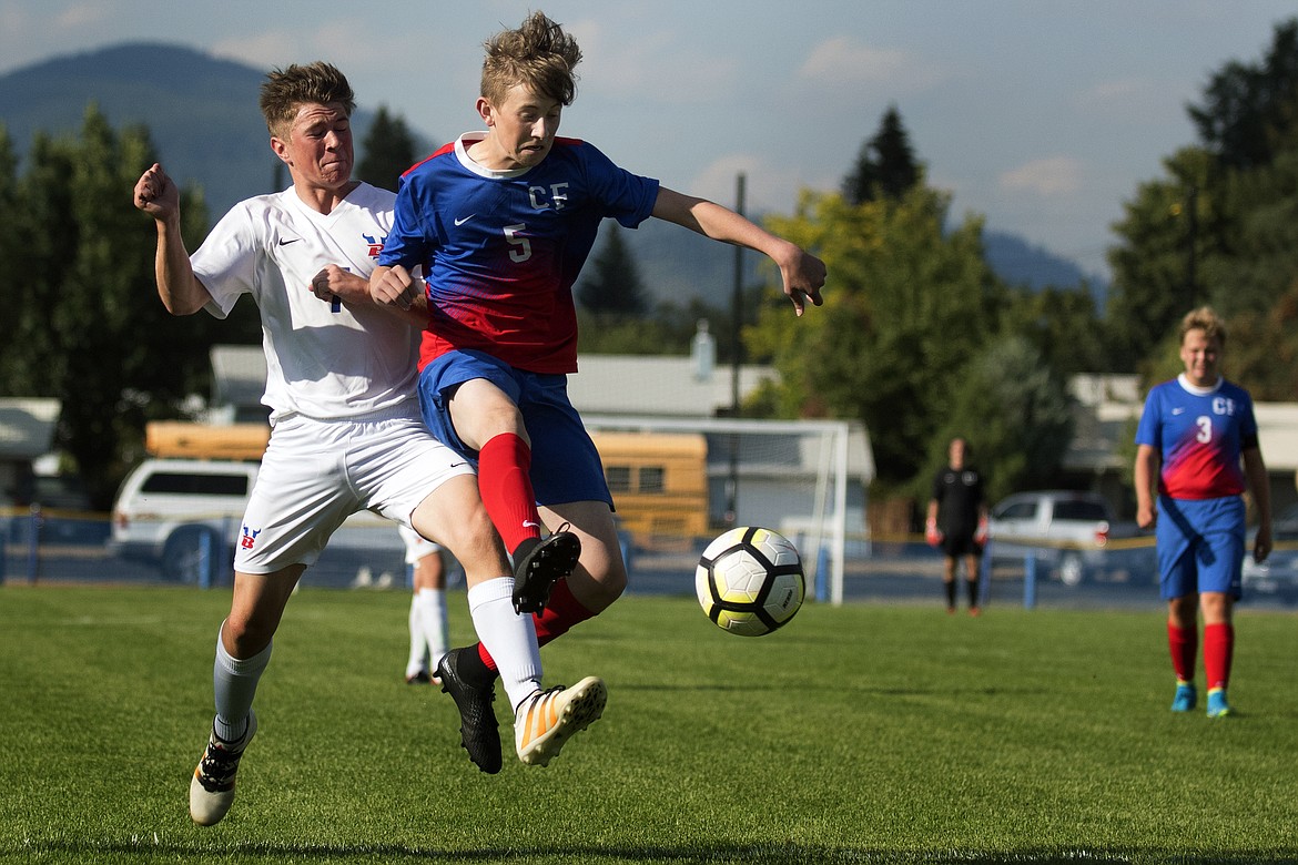 Wildcat Jason Albin battles with Bigfork&#146;s Zane Gardner during the first half of Columbia Falls&#146; 2-0 victory at home Thursday. (Jeremy Weber photo)