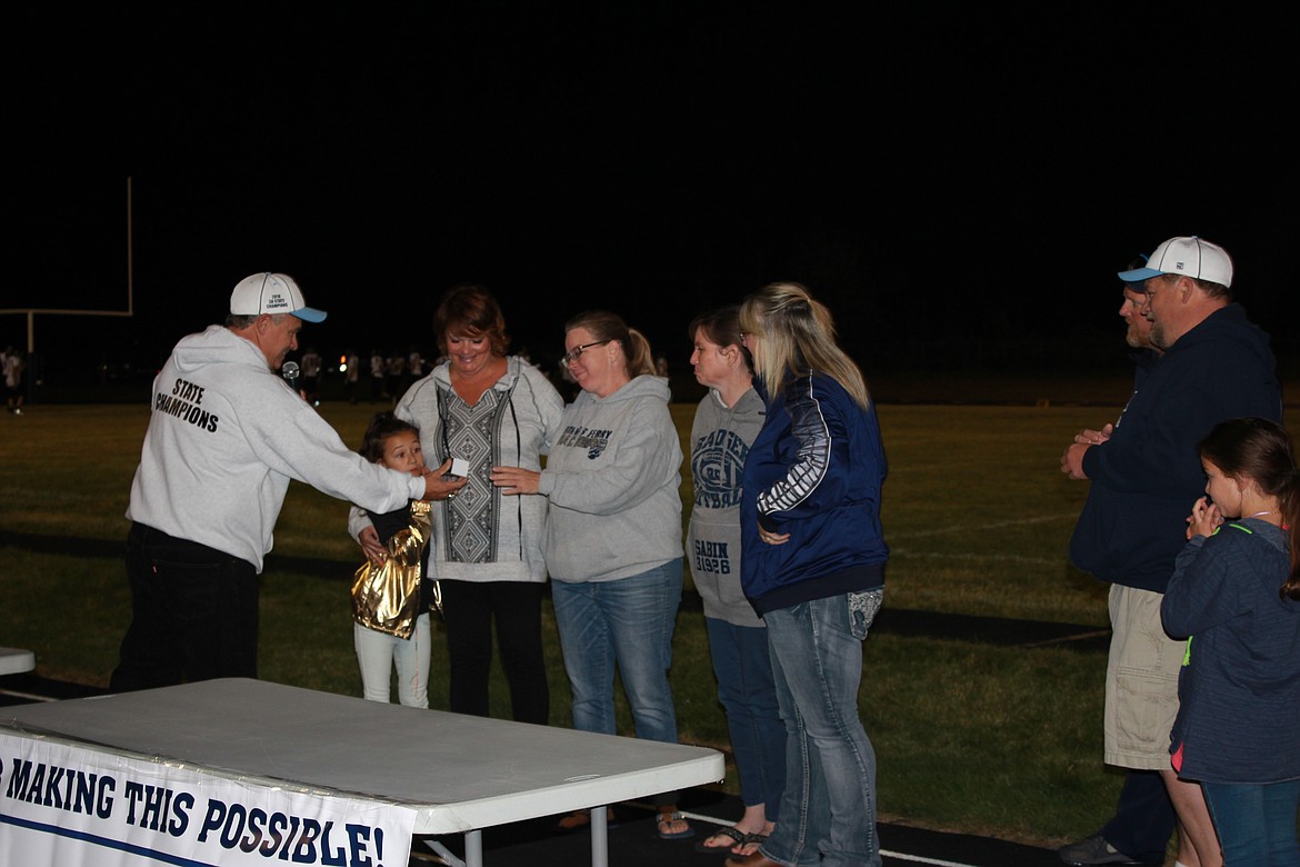 Photo by TANNA YEOUMANS
Coach Tom Turpin also presented the ladies behind the scenes with Championship necklaces.