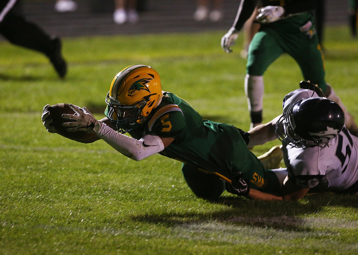 Lakeland High running back Eli Asher reaches for a touchdown against Lake City.